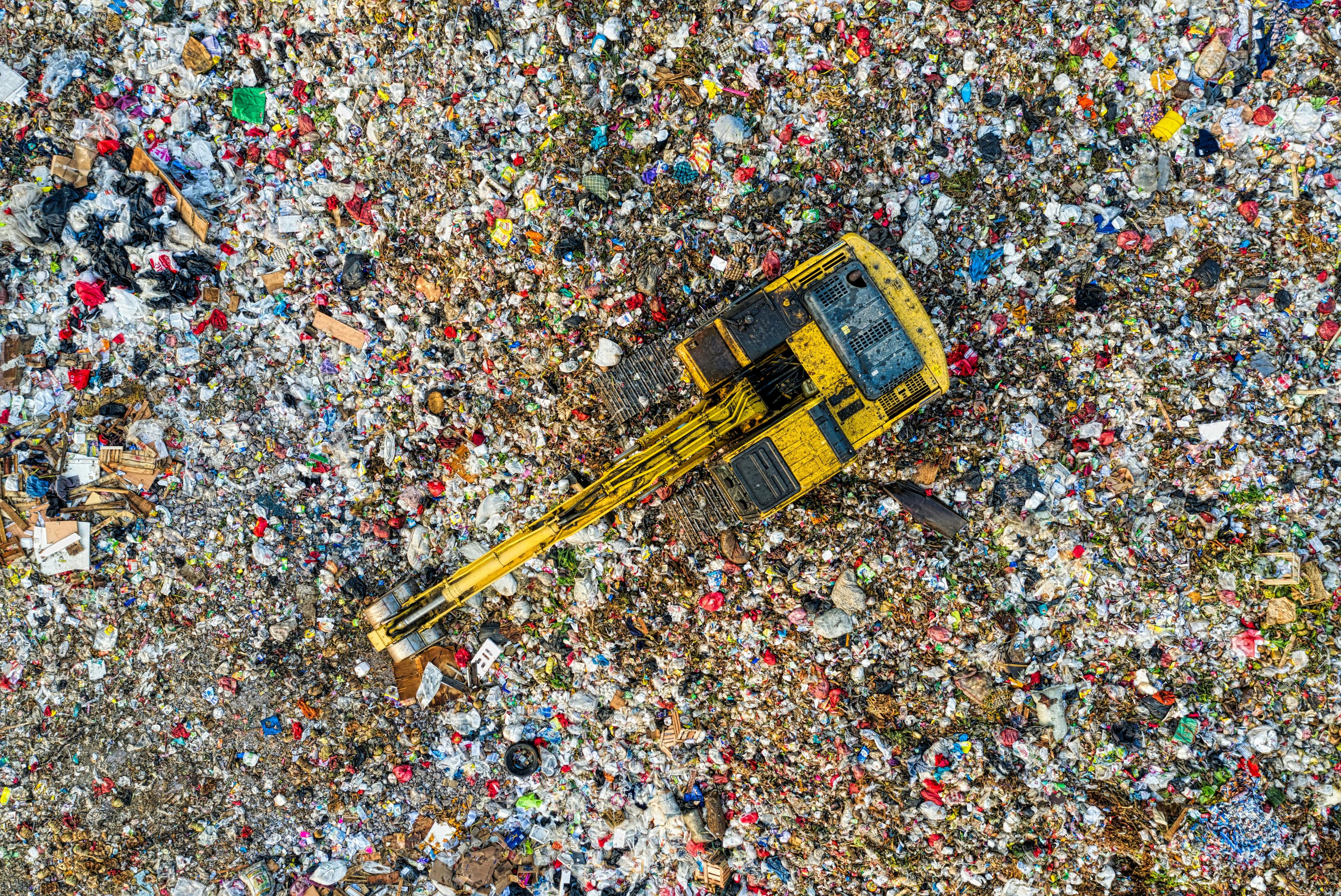 Operators sorting material inside an industrial facility