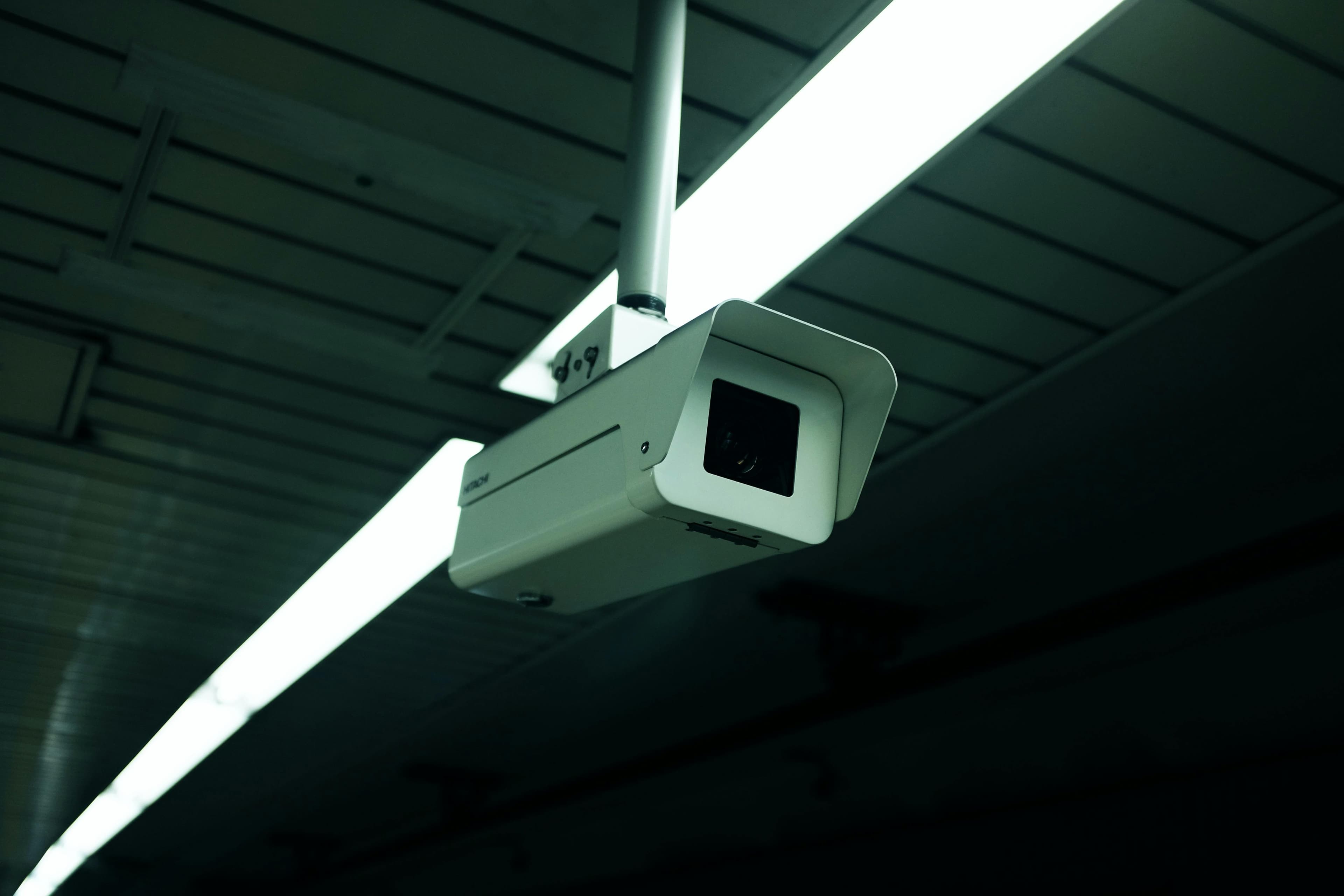 Industrial camera mounted above a production floor